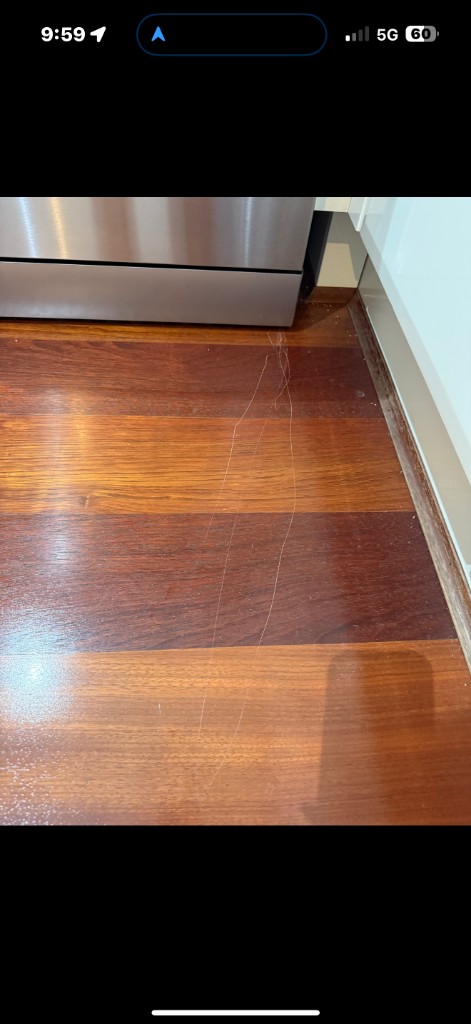 Timber floor with visible scratch wear before repair