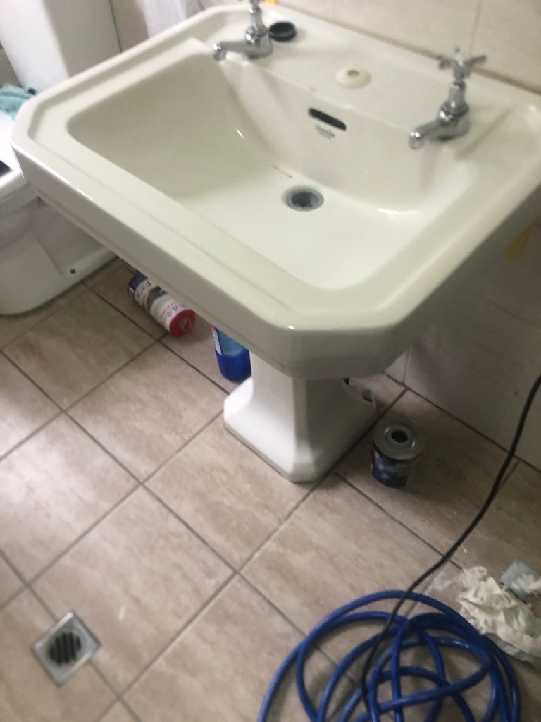 Same ceramic sink after colour-matched chip and crack repair by Magicman